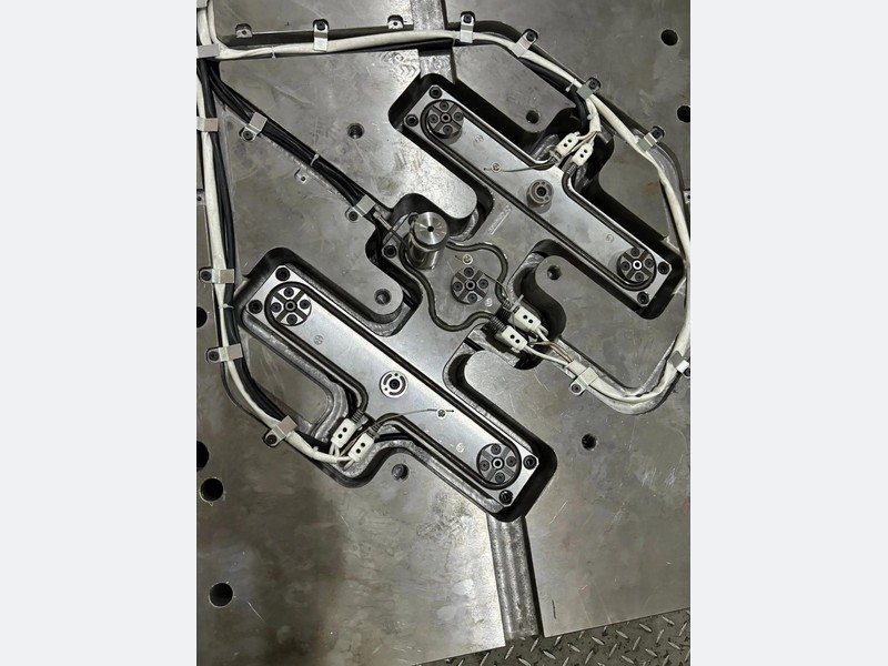Multi-drop hot runner system inside an injection mold