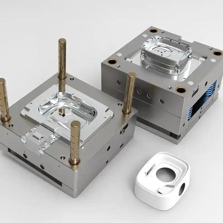 Precision injection mold tooling on a manufacturing bench